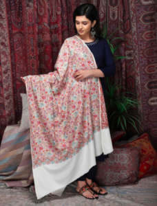 Model wearing embroidered shawl